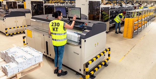 Automated mail production and parcel sorting facility with BlueCrest equipment
