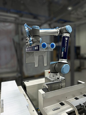 BlueCrest mail inserter cobot puts envelopes into mail trays