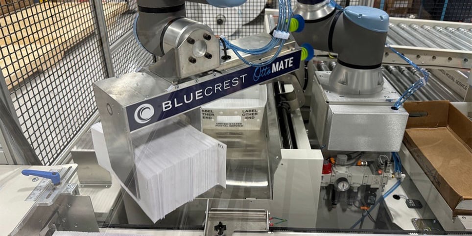 OttoMATE Trayer Cobot placing mail from automated inserter line into USPS trays