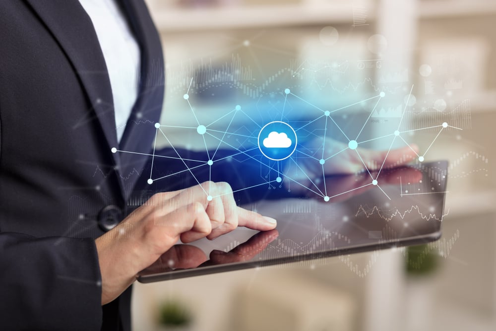 Business woman using tablet with financial, cloud connectivity