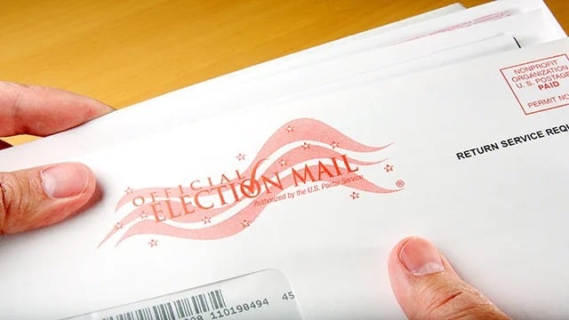 Closeup of vote-by-mail ballot and envelope